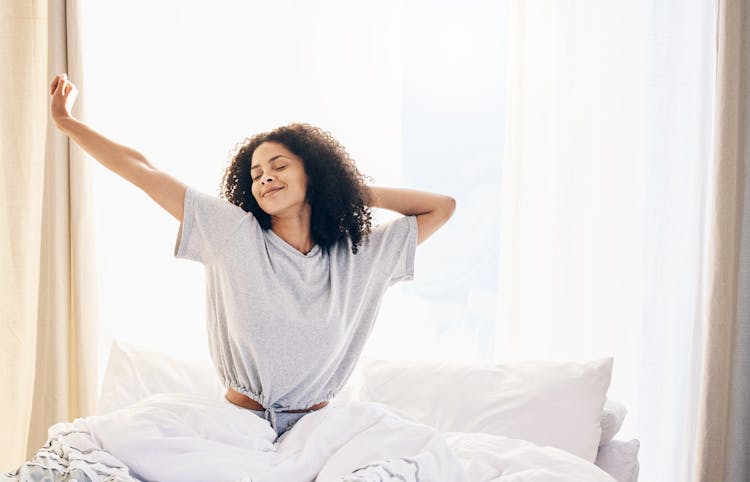 Switch | Image | Adv | Black Woman Morning Stretching and Waking up