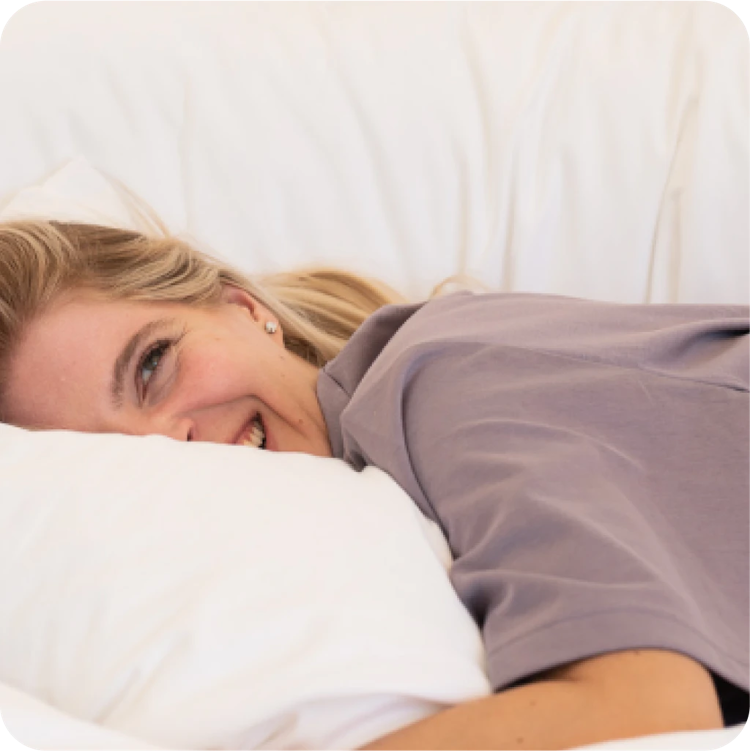 FluffCo | Image | 7 Reason | Happy Woman in bed