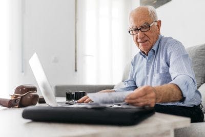 Senior man working with a computer